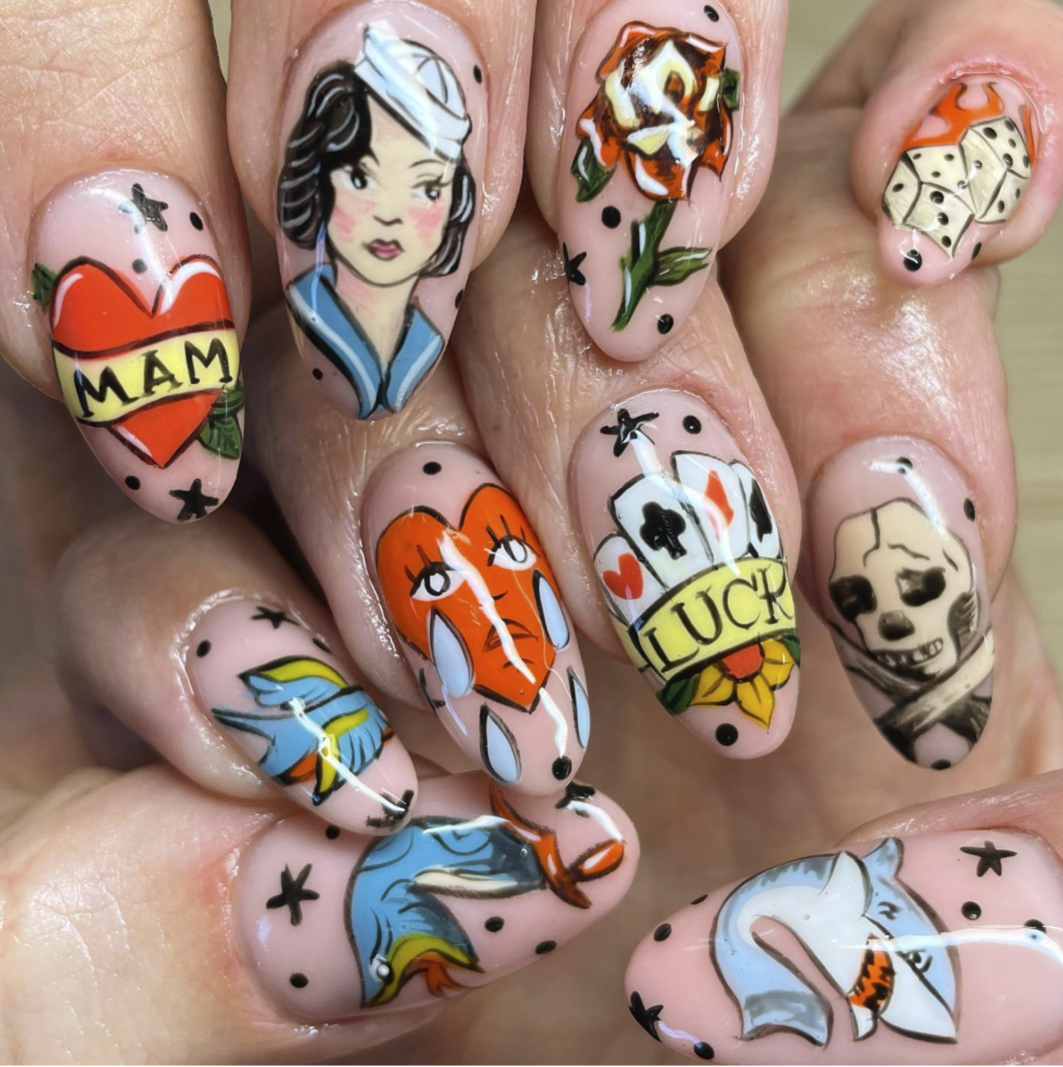 Tattoo-inspired intricate nail art by Lana