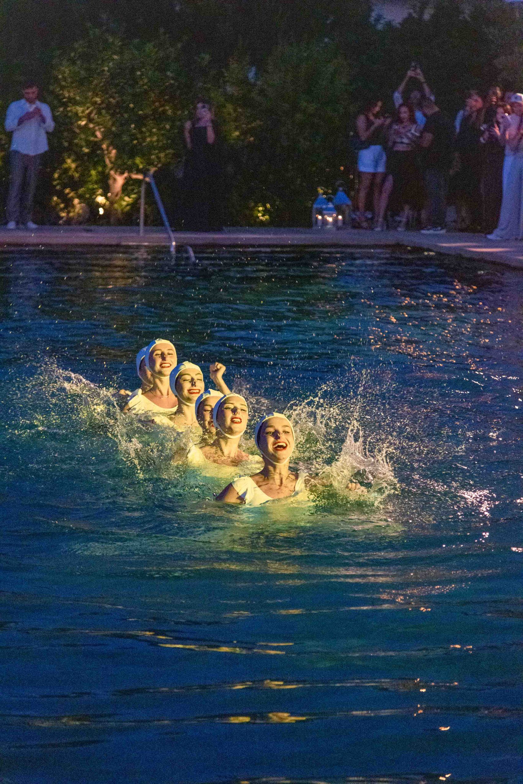 Synchronised swimmers in water