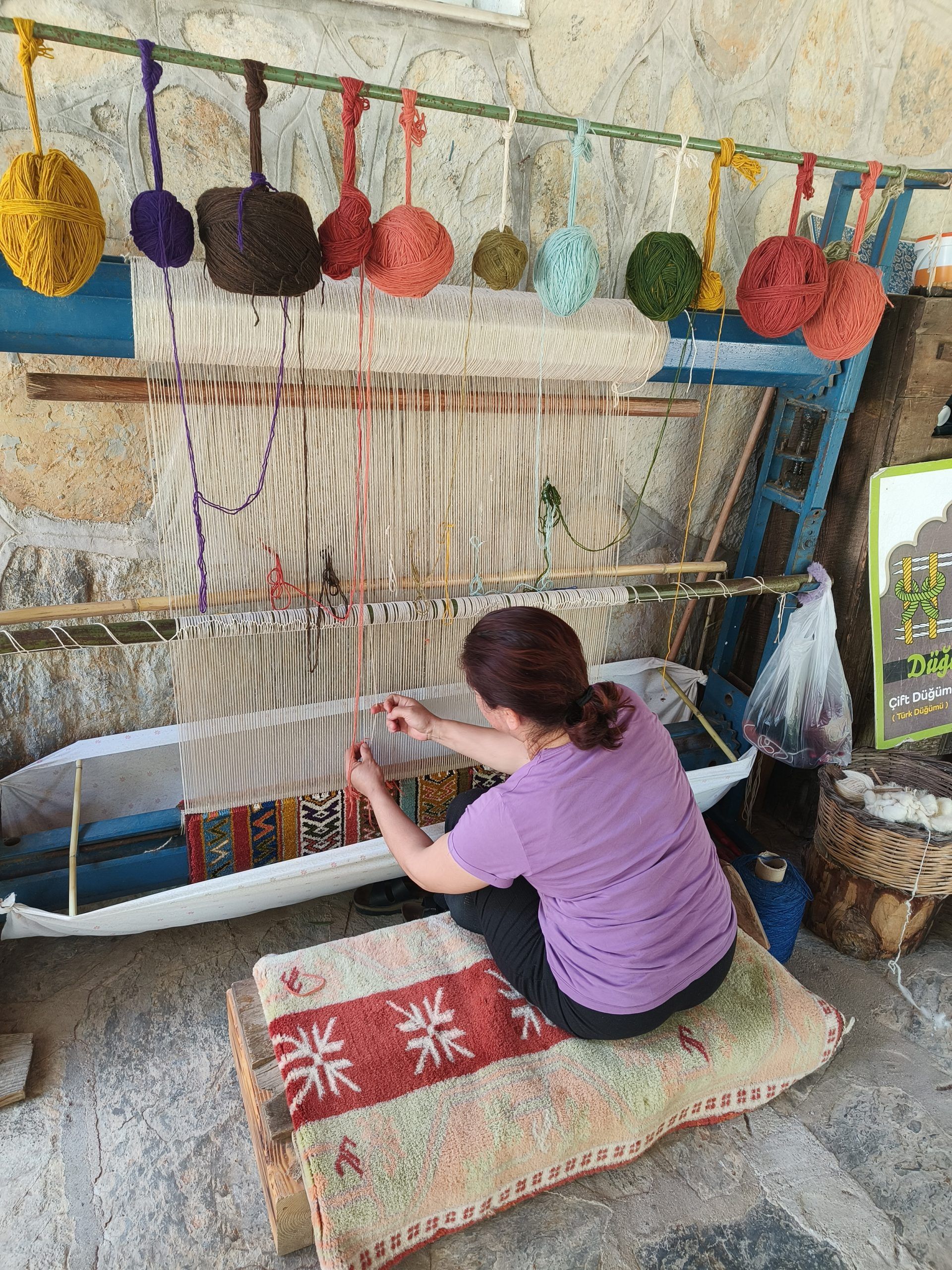 Local woman weaving carpets