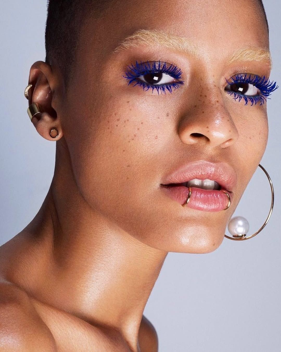Bleached brows and blue mascara on model