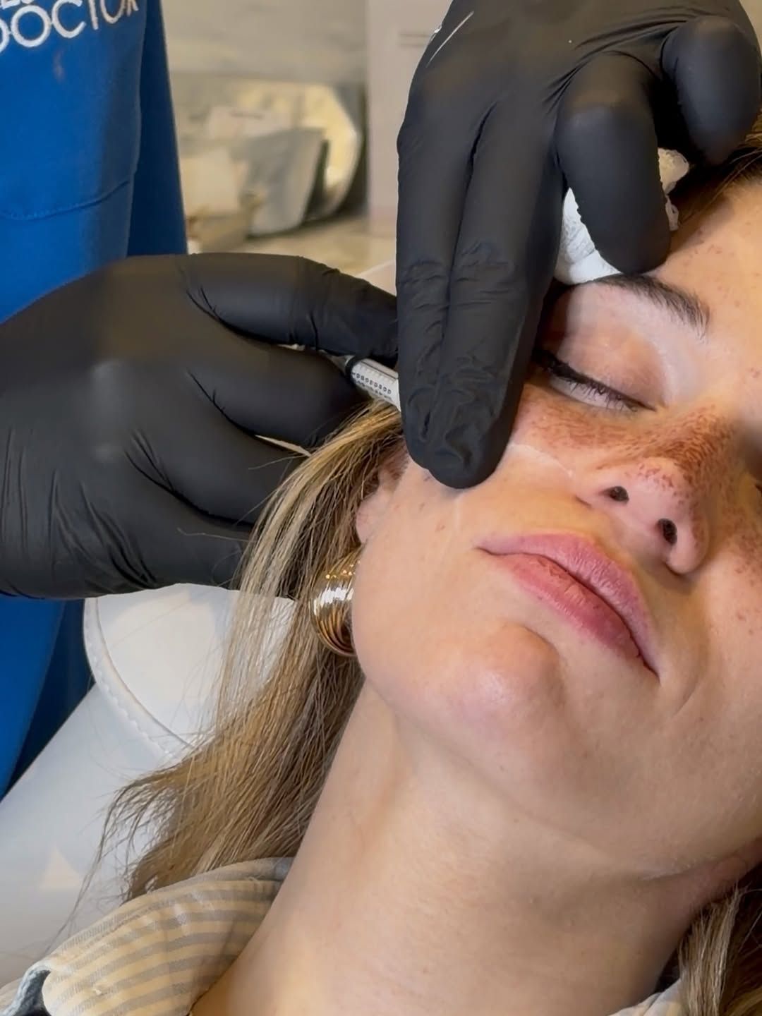 Woman receiving injectables treatment by doctor