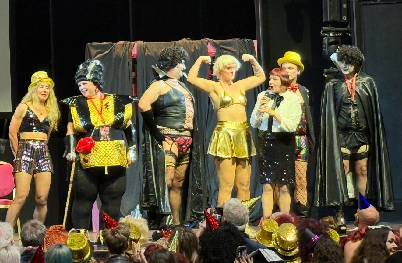 Rocky Horror fans in costume gathered on stage for the anniversary contest