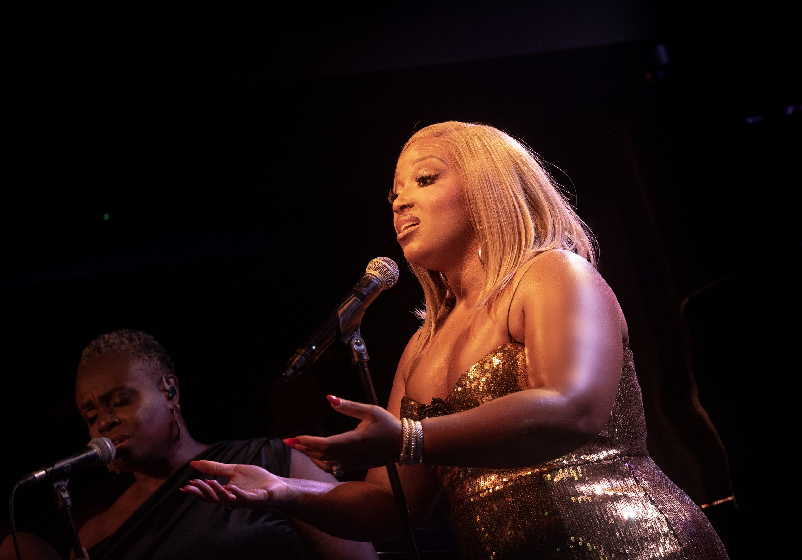 Marisha Wallace gesturing towards the audience at Ronnie Scott’s